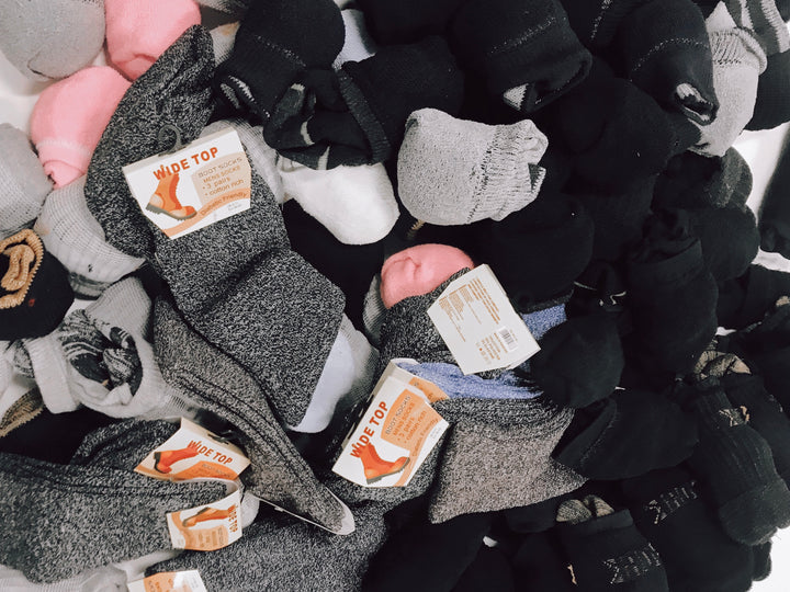 Leiho donating socks to The Shoebox Project