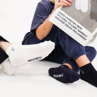 Navy and white sneaker bamboo socks that help people experiencing homelessness